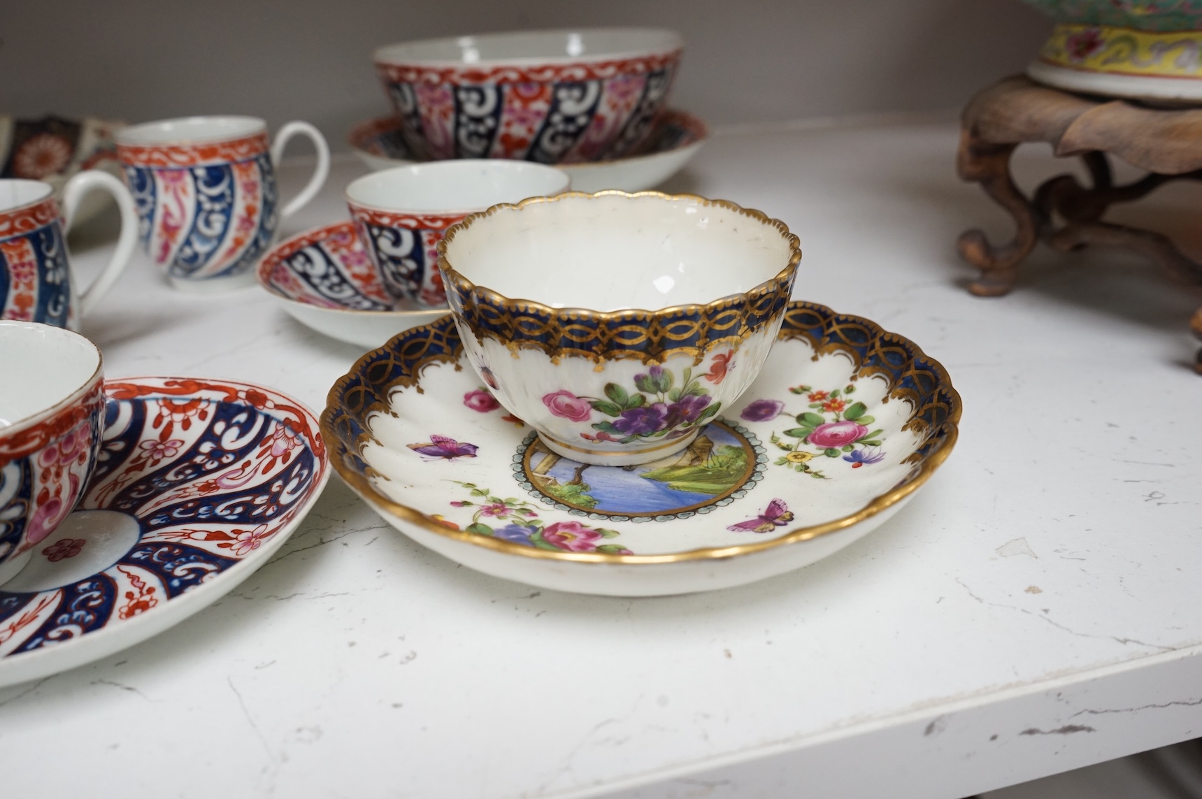A Worcester Lord Henry Thynne type fluted tea bowl and saucer, c.1780, a group of Worcester Queen Charlotte pattern tea and coffee wares, c.1790-1810, two Worcester Kakiemon style dishes, largest 21cm in diameter
